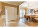 Inviting entryway featuring a bright white door, shuttered sidelights, and tile flooring leading to the dining room at 1630 Chadwick Mill Ln, Lawrenceville, GA 30043