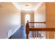 Hallway with hardwood floors and natural light from arched window at 1630 Chadwick Mill Ln, Lawrenceville, GA 30043