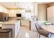 Bright kitchen features stainless steel appliances, white cabinetry and stone countertops at 1630 Chadwick Mill Ln, Lawrenceville, GA 30043