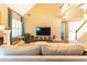 Open living room showcasing high ceilings, hardwood floors, fireplace, and a neutral color palette at 1630 Chadwick Mill Ln, Lawrenceville, GA 30043