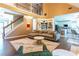 Living room showcasing an open floor plan, a smooth transition to the kitchen, and hardwood floors at 1630 Chadwick Mill Ln, Lawrenceville, GA 30043
