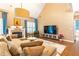 Beautiful living room with vaulted ceiling, fireplace, hardwood floors, and a cozy seating area at 1630 Chadwick Mill Ln, Lawrenceville, GA 30043