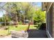 Cozy patio with comfortable seating, overlooking a lush backyard and tranquil garden shed at 1630 Chadwick Mill Ln, Lawrenceville, GA 30043