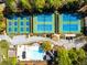 Aerial view of tennis courts near pool and surrounding amenities at 1630 Chadwick Mill Ln, Lawrenceville, GA 30043
