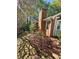 The brick house featuring an outdoor space with trees, chimney, and foliage at 1910 Cooper Landing Se Dr, Smyrna, GA 30080