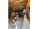 Finished basement with sealed flooring, exposed ceiling, and storage at 1910 Cooper Landing Se Dr, Smyrna, GA 30080
