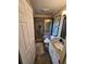 Modern bathroom with a tiled shower, granite countertop vanity, and sleek fixtures at 1910 Cooper Landing Se Dr, Smyrna, GA 30080