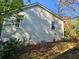 Exterior view of the house with siding, windows, chimney, and landscaping at 1910 Cooper Landing Se Dr, Smyrna, GA 30080