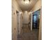 Hallway with neutral carpeting and trim that leads to various rooms and storage areas at 1910 Cooper Landing Se Dr, Smyrna, GA 30080