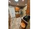 Traditional kitchen features wood cabinets, stainless refrigerator, and tile flooring at 1910 Cooper Landing Se Dr, Smyrna, GA 30080