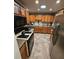 Functional kitchen with stainless steel appliances and natural wood cabinetry at 1910 Cooper Landing Se Dr, Smyrna, GA 30080