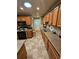 Bright kitchen features wood cabinetry, laminate counters, and stainless sink at 1910 Cooper Landing Se Dr, Smyrna, GA 30080