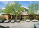 Property exterior showcasing parking and building architecture with mature trees in a residential area at 310 Brittany Ct, Duluth, GA 30096