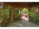 Interior view of a wooden gazebo surrounded by trees and flowering bushes at 310 Brittany Ct, Duluth, GA 30096