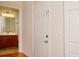 Inviting entryway with a view of the bathroom offering tiled floors and wood vanity at 310 Brittany Ct, Duluth, GA 30096