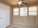 Bright sunroom featuring a ceiling fan, vertical blinds, tile flooring, and access to a door at 310 Brittany Ct, Duluth, GA 30096