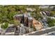 Aerial view showcasing brick condos amidst trees and surrounding neighborhood streets, offering a central location at 3235 Roswell Ne Rd # 508, Atlanta, GA 30305