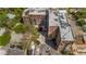 An aerial view shows the brick apartment complex with trees, parking, and other nearby buildings at 3235 Roswell Ne Rd # 508, Atlanta, GA 30305