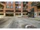 Brick building exterior featuring covered parking, private balconies, and inviting entrance to the condos at 3235 Roswell Ne Rd # 508, Atlanta, GA 30305