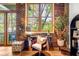 Stylish home office space with natural light and refined décor in an industrial-chic setting at 3235 Roswell Ne Rd # 508, Atlanta, GA 30305