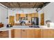 Kitchen featuring light wood cabinets, stainless steel appliances, and a curved breakfast bar at 3235 Roswell Ne Rd # 508, Atlanta, GA 30305