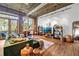 Inviting living room with exposed brick, and access to a balcony offering city views at 3235 Roswell Ne Rd # 508, Atlanta, GA 30305