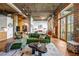 Elegant living area with modern decor, exposed ductwork, brick accents, and an open layout at 3235 Roswell Ne Rd # 508, Atlanta, GA 30305