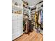Organized walk-in closet with custom shelving for clothing, shoes, and accessories at 3235 Roswell Ne Rd # 508, Atlanta, GA 30305