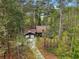 Aerial view of home with large garage surrounded by lush green trees at 758 Lauren Cir, Lawrenceville, GA 30043