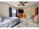 Bedroom with a large television, adjacent bathroom, and comfortable seating area at 758 Lauren Cir, Lawrenceville, GA 30043