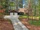 Charming two-story home with a brick chimney, attached garage, and long driveway at 758 Lauren Cir, Lawrenceville, GA 30043
