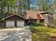 Charming two-story home with a brick chimney, attached garage, and well-manicured lawn at 758 Lauren Cir, Lawrenceville, GA 30043