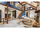 Open living room features a grand staircase, exposed beams, fireplace, and access to other rooms at 758 Lauren Cir, Lawrenceville, GA 30043