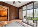 Sunroom with wood paneling, many windows, and a view of the outdoors at 758 Lauren Cir, Lawrenceville, GA 30043