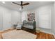 This Bedroom features a wooden floor and an elephant painting at 2930 Ringle Rd, Brookhaven, GA 30341