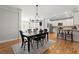 Bright open floorplan with dining area and kitchen featuring stainless steel appliances and light wood floors at 2930 Ringle Rd, Brookhaven, GA 30341