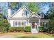 Charming home featuring a manicured lawn, welcoming entryway, and classic architectural details at 2930 Ringle Rd, Brookhaven, GA 30341