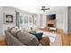 Cozy living room features hardwood floors, stone fireplace, and windows that bring in natural light at 2930 Ringle Rd, Brookhaven, GA 30341