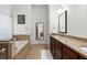 Serene main bathroom featuring double vanity, soaking tub, and elegant finishes at 2930 Ringle Rd, Brookhaven, GA 30341