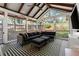 Screened porch with a large sectional and an outdoor view at 2930 Ringle Rd, Brookhaven, GA 30341
