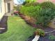 Landscaped backyard featuring a well-maintained lawn and colorful garden beds for outdoor enjoyment at 314 Lakeside Trce, Canton, GA 30115