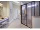 Bathroom featuring a glass shower, granite countertops, and elegant fixtures at 314 Lakeside Trce, Canton, GA 30115