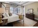 Bright bedroom with a four-poster bed, dresser, and plenty of natural light at 314 Lakeside Trce, Canton, GA 30115