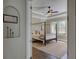 Elegant bedroom with a four-poster bed, neutral tones, and large windows at 314 Lakeside Trce, Canton, GA 30115