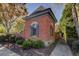 Brick building with an arched window and green shrubs at 314 Lakeside Trce, Canton, GA 30115