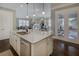 Kitchen island with stainless steel sink and seating area at 314 Lakeside Trce, Canton, GA 30115