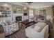 Cozy living room featuring a fireplace, built-in shelves, and comfortable seating arrangement at 314 Lakeside Trce, Canton, GA 30115