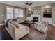 Inviting living room showcasing a fireplace, built-in bookcases, and hardwood floors at 314 Lakeside Trce, Canton, GA 30115