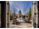Charming outdoor patio with a stone fireplace, patio seating, and views of the landscaped garden at 314 Lakeside Trce, Canton, GA 30115