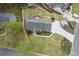 Picturesque aerial view of the home with a sprawling lawn, landscaped gardens, and a spacious backyard at 4950 Willow Creek Dr, Woodstock, GA 30188
